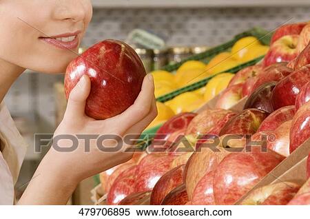 Woman buying apples in a supermarket View Large Photo Image Stock Photography - Woman buying apples in a supermarket. Fotosearch