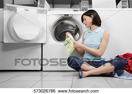 Woman doing laundry View Large Photo Image Stock Photograph - Woman doing laundry. Fotosearch