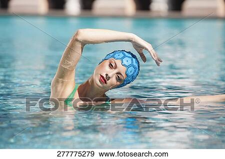 Stock Photo - Woman doing water aerobics in a swimming pool, Biltmore Hotel, Coral Gables, Florida, USA. Fotosearch