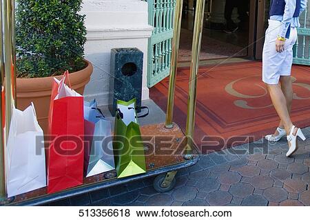 Woman entering in a hotel with luggage in a luggage cart, Biltmore Hotel, Coral Gables, Florida, USA View Large Photo Image Stock Photo - Woman entering in a hotel with luggage in a luggage cart, Biltmore Hotel, Coral Gables, Florida, USA. Fotosearch