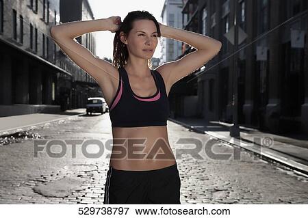 Woman exercising View Large Photo Image Stock Photo - Woman exercising. Fotosearch