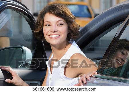 Woman getting out of a car and smiling, Biltmore Hotel, Coral Gables, Florida, USA View Large Photo Image Stock Photograph - Woman getting out of a car and smiling, Biltmore Hotel, Coral Gables, Florida, USA. Fotosearch