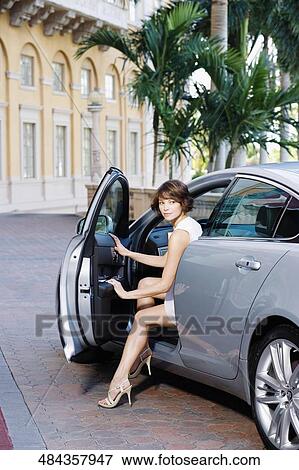 Woman getting out of a car, Biltmore Hotel, Coral Gables, Florida, USA View Large Photo Image Stock Photo - Woman getting out of a car, Biltmore Hotel, Coral Gables, Florida, USA. Fotosearch
