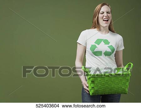 Woman holding a recycling bin View Large Photo Image Picture - Woman holding a recycling bin. Fotosearch