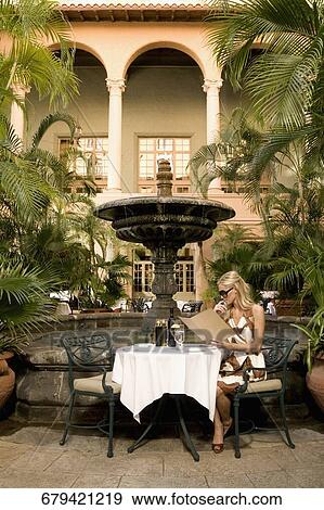 Woman holding menu cards, Biltmore Hotel, Coral Gables, Florida, USA View Large Photo Image Stock Photo - Woman holding menu cards, Biltmore Hotel, Coral Gables, Florida, USA. Fotosearch