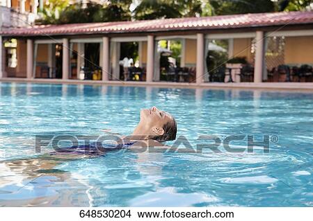 Picture - Woman in a swimming pool, Biltmore Hotel, Coral Gables, Florida, USA. Fotosearch