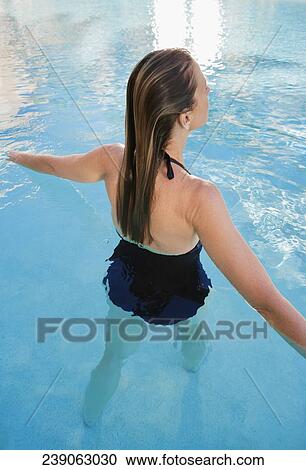 Stock Image - Woman in a swimming pool, Biltmore Hotel, Coral Gables, Florida, USA. Fotosearch