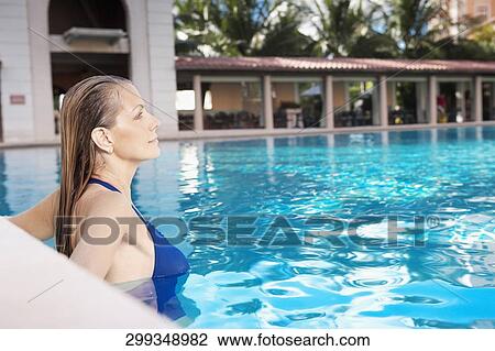 Woman in a swimming pool, Biltmore Hotel, Coral Gables, Florida, USA View Large Photo Image Stock Image - Woman in a swimming pool, Biltmore Hotel, Coral Gables, Florida, USA. Fotosearch