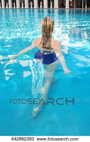 Stock Image - Woman in a swimming pool, Biltmore Hotel, Coral Gables, Florida, USA. Fotosearch