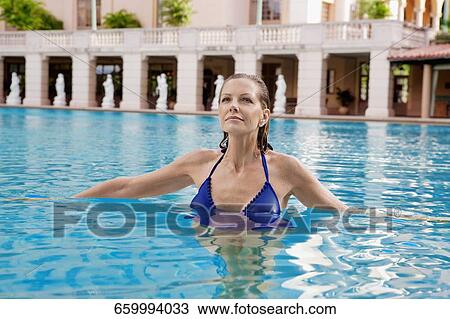 Woman in a swimming pool, Biltmore Hotel, Coral Gables, Florida, USA View Large Photo Image Stock Image - Woman in a swimming pool, Biltmore Hotel, Coral Gables, Florida, USA. Fotosearch
