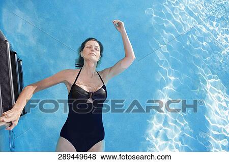 Woman in a swimming pool, Biltmore Hotel, Coral Gables, Florida, USA View Large Photo Image Stock Photo - Woman in a swimming pool, Biltmore Hotel, Coral Gables, Florida, USA. Fotosearch