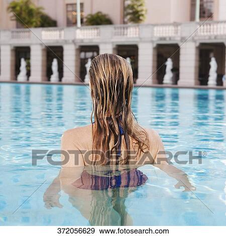 Stock Photo - Woman in a swimming pool, Biltmore Hotel, Coral Gables, Florida, USA. Fotosearch