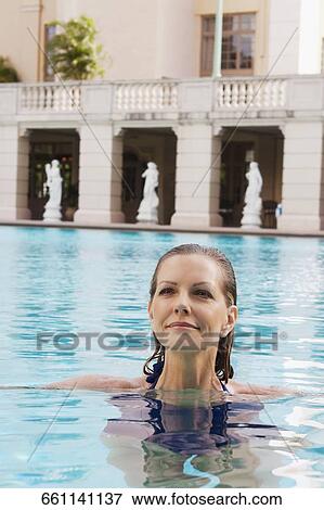 Stock Photo - Woman in a swimming pool, Biltmore Hotel, Coral Gables, Florida, USA. Fotosearch
