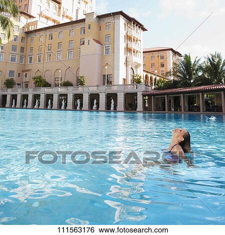 Woman in a swimming pool, Biltmore Hotel, Coral Gables, Florida, USA View Large Photo Image Stock Photograph - Woman in a swimming pool, Biltmore Hotel, Coral Gables, Florida, USA. Fotosearch