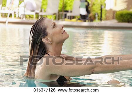 Stock Photograph - Woman in a swimming pool, Biltmore Hotel, Coral Gables, Florida, USA. Fotosearch