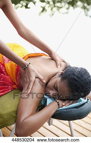 Picture - Woman receiving a back massage. Fotosearch