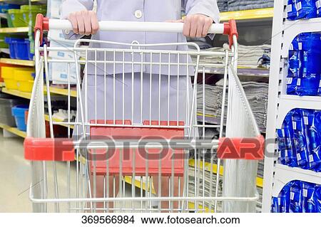 Woman shopping in a supermarket View Large Photo Image Picture - Woman shopping in a supermarket. Fotosearch