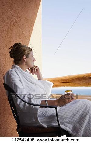 Woman sitting in a hotel's balcony and thinking, Cabo San Lucas, Mexico View Large Photo Image Stock Photo - Woman sitting in a hotel's balcony and thinking, Cabo San Lucas, Mexico. Fotosearch