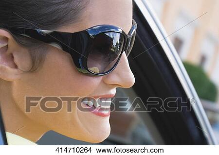 Woman smiling in a car, Biltmore Hotel, Coral Gables, Florida, USA View Large Photo Image Picture - Woman smiling in a car, Biltmore Hotel, Coral Gables, Florida, USA. Fotosearch