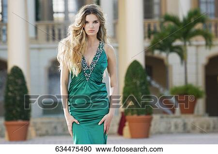 Stock Image - Woman standing in front of a hotel, Biltmore Hotel, Coral Gables, Florida, USA. Fotosearch