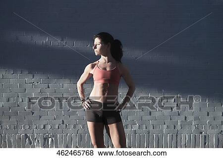 Woman standing with arms akimbo View Large Photo Image Stock Photo - Woman standing with arms akimbo. Fotosearch
