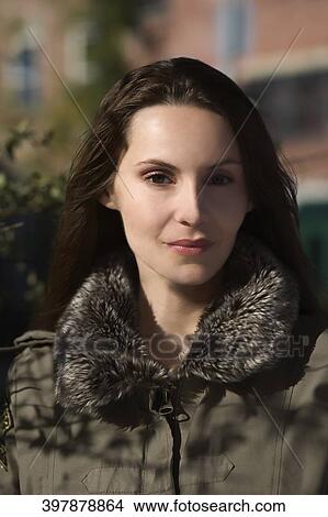 Woman wearing fur coat and smiling View Large Photo Image Picture - Woman wearing fur coat and smiling. Fotosearch