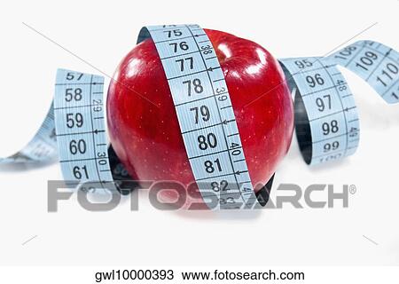 Apple wrapped in a tape measure View Large Photo Image Stock Image - Apple wrapped in a tape measure. Fotosearch