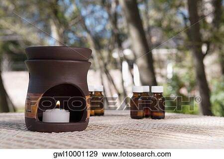 Aromatherapy burner with aromatherapy oil bottles View Large Photo Image Stock Photo - Aromatherapy burner with aromatherapy oil bottles. Fotosearch