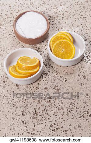 Bowls of orange slices and moisturizer cream at poolside View Large Photo Image Stock Photo - Bowls of orange slices and moisturizer cream at poolside. Fotosearch
