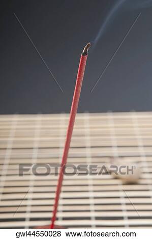 Burning incense stick with a pebble View Large Photo Image Stock Photo - Burning incense stick with a pebble. Fotosearch
