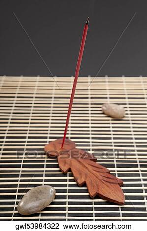 Burning incense stick with pebbles View Large Photo Image Stock Image - Burning incense stick with pebbles. Fotosearch