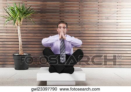 Businessman practicing yoga View Large Photo Image Stock Image - Businessman practicing yoga. Fotosearch