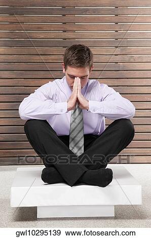 Businessman practicing yoga View Large Photo Image Stock Photo - Businessman practicing yoga. Fotosearch