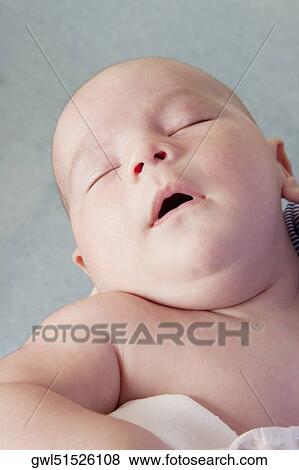 Close-up of a baby sleeping View Large Photo Image Stock Photo - Close-up of a baby sleeping. Fotosearch