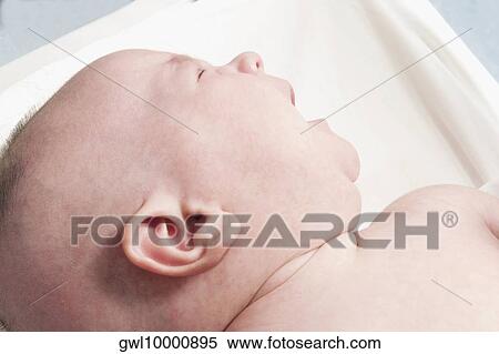 Close-up of a baby sleeping View Large Photo Image Stock Photography - Close-up of a baby sleeping. Fotosearch