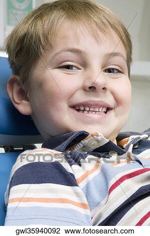 Close-up of a boy smiling View Large Photo Image Stock Image - Close-up of a boy smiling. Fotosearch