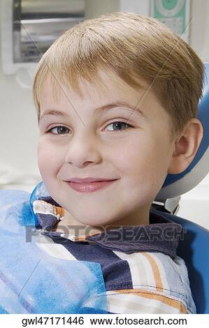Close-up of a boy smiling View Large Photo Image Stock Photograph - Close-up of a boy smiling. Fotosearch