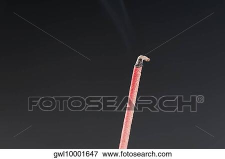 Close-up of a burning incense stick View Large Photo Image Stock Photo - Close-up of a burning incense stick. Fotosearch