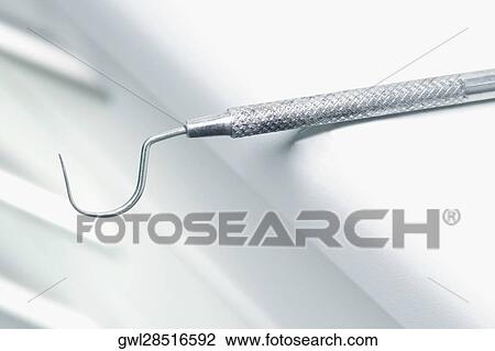Stock Image - Close-up of a dental scaler in an examination room. Fotosearch