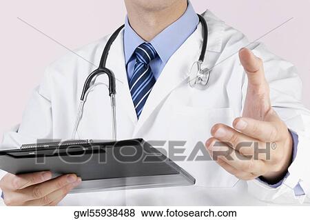 Stock Photo - Close-up of a doctor holding a clipboard. Fotosearch
