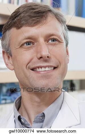 Close-up of a doctor smiling in a laboratory View Large Photo Image Picture - Close-up of a doctor smiling in a laboratory. Fotosearch