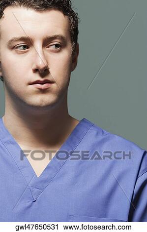 Close-up of a doctor thinking View Large Photo Image Stock Image - Close-up of a doctor thinking. Fotosearch