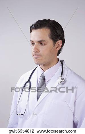 Stock Image - Close-up of a doctor thinking. Fotosearch