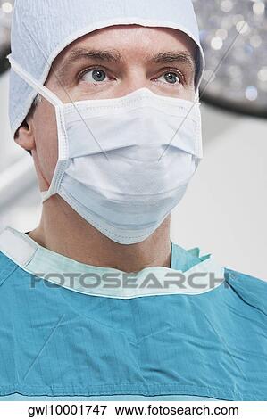 Close-up of a doctor thinking View Large Photo Image Stock Photo - Close-up of a doctor thinking. Fotosearch