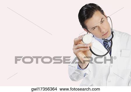 Close-up of a doctor with a stethoscope View Large Photo Image Picture - Close-up of a doctor with a stethoscope. Fotosearch