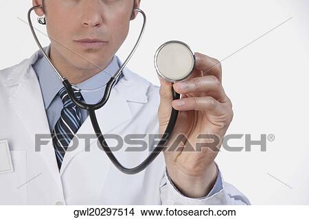 Close-up of a doctor with a stethoscope View Large Photo Image Picture - Close-up of a doctor with a stethoscope. Fotosearch