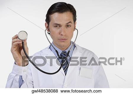 Close-up of a doctor with a stethoscope View Large Photo Image Stock Photo - Close-up of a doctor with a stethoscope. Fotosearch