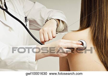 Close-up of a doctor's hand examining a patient View Large Photo Image Stock Image - Close-up of a doctor's hand examining a patient. Fotosearch