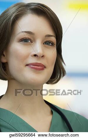 Close-up of a female doctor smiling View Large Photo Image Picture - Close-up of a female doctor smiling. Fotosearch