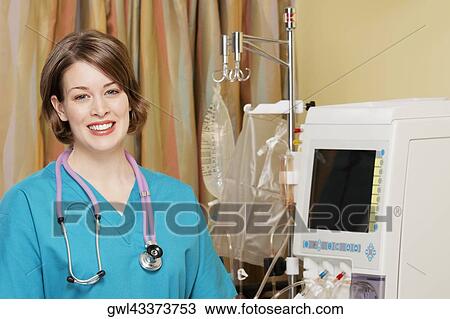 Close-up of a female doctor smiling View Large Photo Image Stock Image - Close-up of a female doctor smiling. Fotosearch